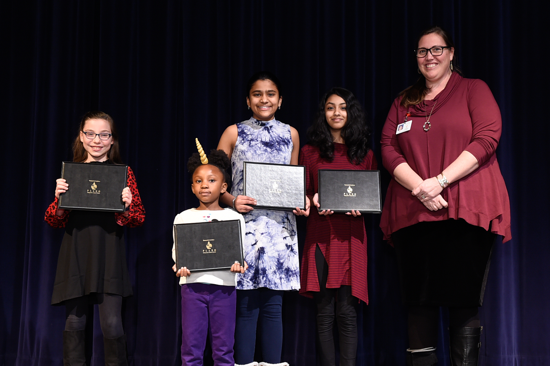 Art contest winners with Visual Arts Coordinator Laura Grundler 